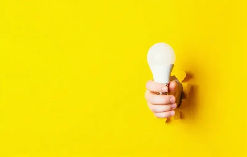 A person using a laptop to strategize content planning with the help of AI tools.