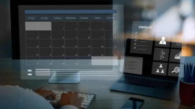 A person using a laptop to strategize content planning with the help of AI tools.
